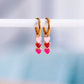 Boucles d'oreilles créoles en acier inoxydable avec 3 cœurs - tons roses - Bazou