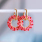 Boucle d'oreille avec pendentif rond à facettes cerise – Bazou