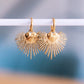 Boucles d'oreilles créoles avec cœur et rayons - doré – Bazou