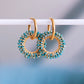Boucle d'oreille avec pendentif rond à facettes émeraude – Bazou