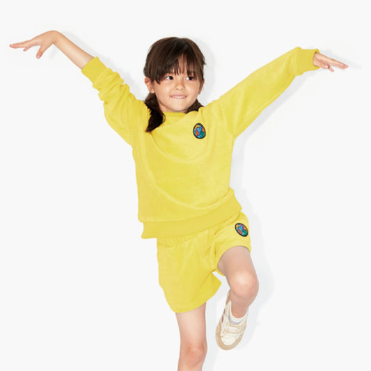 Short éponge jaune et vert badge "Planète iconique" pour enfant